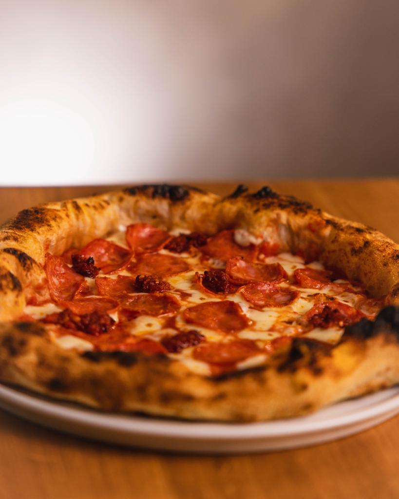 Pizza made with the freshest ingredients, served on a plate.